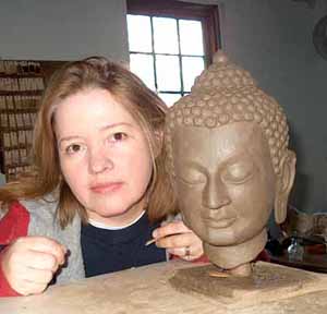 Sculptor Lisa Sofman with the clay prototype for the statue of Kyabje Ling Rinpoche.