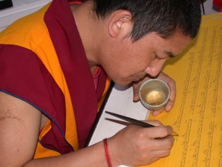 Ven.Tsering writing the Prajnaparamita in gold at Kachoe Dechen Ling, USA