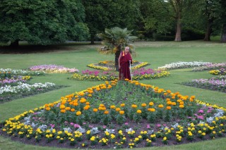 Lama Zopa Rinpoche offering all the flowers in the park to the guru, Leeds, UK, July 2014. Photo by Ven. Roger Kunsang.