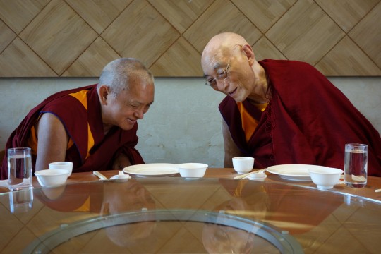 Lama Zopa Rinpoche offering lunch to Choden Rinpoche during Monlam, Taiwan, February 2013. Photo by Ven. Roger Kusang.