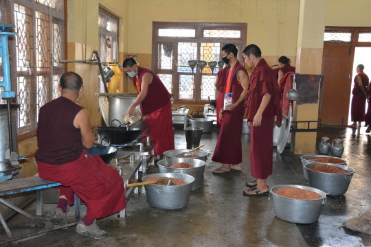 Sera Je monks help prepare meals for 2,500 in the Sera Je Food Fund kitchen.