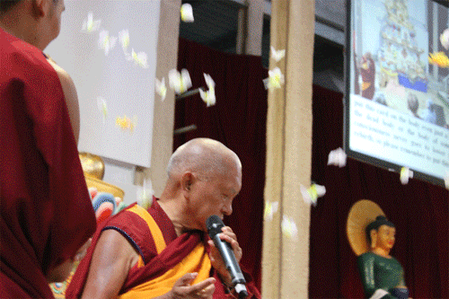 Lama Zopa Rinpoche and flower falling from above, Great Stupa of Universal Compassion, Australia, September 20, 2014. Photos by Tom Truty.