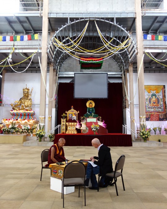Lama Zopa Rinpoche and Ian Green discussing the art and decorations for the Great Stupa of Universal Compassion interior, Bendigo, Australia, October 2014. Photo by Ven. Roger Kunsang.