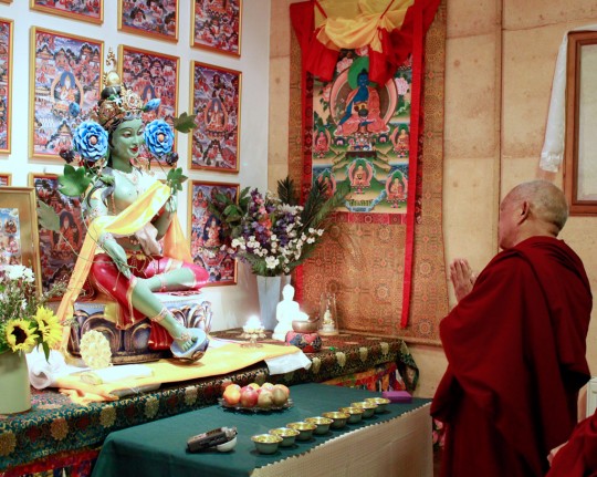 Lama Zopa Rinpoche blessing the Green Tara statue in Atisha Centre's gompa, Bendigo, Australia, September 2014. Photo by Ven. Thubten Kunsang.