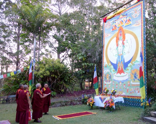 Lama Zopa Rinpoche with large Chenrezig thangka at Chenrezig Institute, Eudlo, Queensland, Australia, September 2014. Photo by Ven. Roger Kunsang.