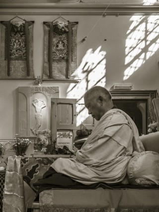 Lama Zopa Rinpoche preparing to teach at Jamyang Buddhist Centre, London, UK, July 2014. Photo by Pierre Aloize.
