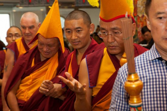 Lama Zopa Rinpoche being led into the long life puja offered by Amitabha Buddhist Centre in Singapore, November 23, 2014. 