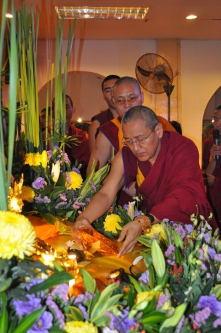Khen Rinpoche Geshe Chonyi offering a large jewel to Dzambhala during the 1K Event 2013, Losang Dragpa Centre, Kuala Lumpur, Malaysia, October 2013. Photo by Elenie Tan.