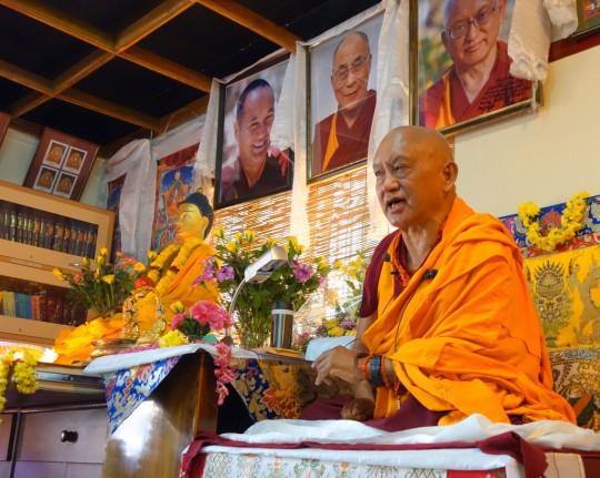 Lama Zopa Rinpoche teaching at Choe Khor Sum Ling, Bangalore, India, March 2014. Photo by Ven. Roger Kunsang. 