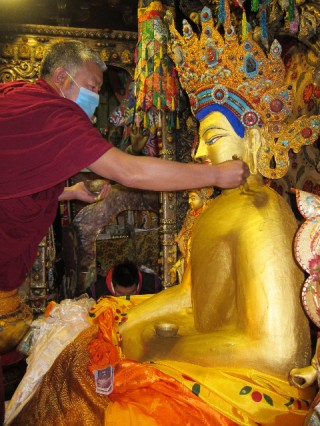Gold is offered every month to the precious Jowo Buddha statue in Lhasa, Tibet. 