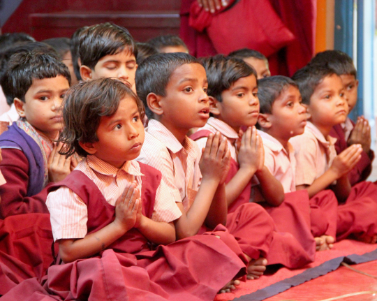 Students of Maitreya School listening to Lama Zopa Rinpoche, Root Institute, Bodhgaya, India, March 2015. Photo by Ven. Roger Kunsang.