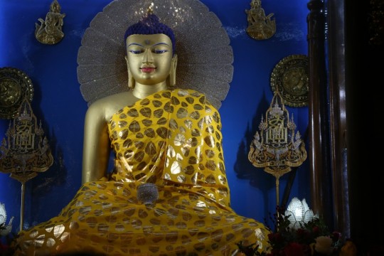 Beautiful Buddha in Mahabodhi Temple, Bodhgaya. The Puja Fund offers best quality robes to this statue every month. Photo by Thubten Kunsang. 