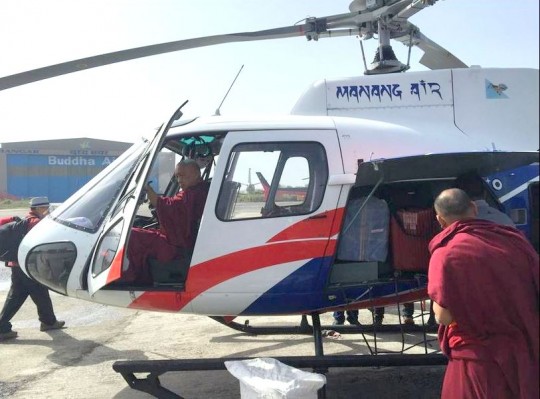 Lama Zopa Rinpoche boarding the helicopter for Lawudo, Nepal, April 2014. Photo by Ven. Roger Kunsang.