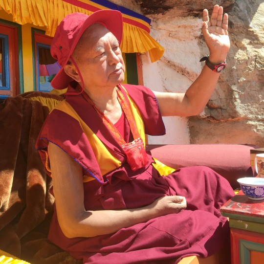 Lama Zopa Rinpoche describing some of his ideas for Lawudo Gompa and Retreat Centre, Nepal, April 2015. Photo by Ven. Roger Kunsang.