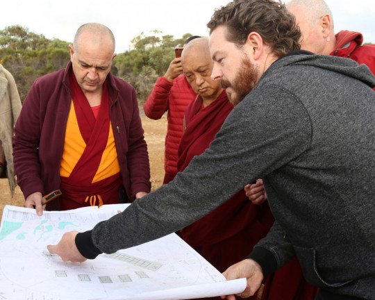 Lama Zopa Rinpoche with Ven. Dhundrup and Dale, the architect, going over the plans for a group retreat facility at Detong Ling Retreat Centre, Kangaroo Island, Australia.