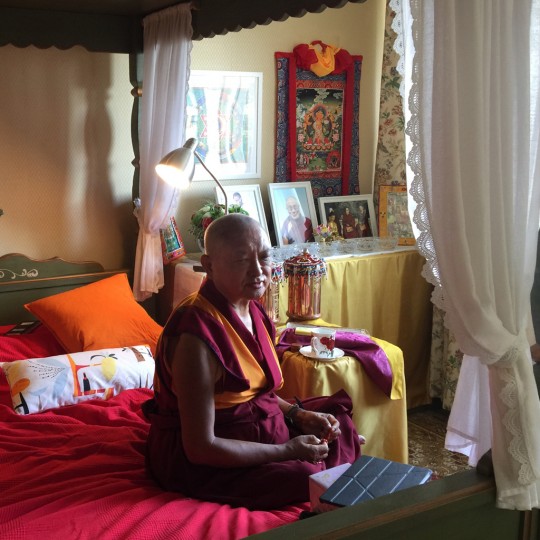 Lama Zopa Rinpoche doing morning prayers in Moscow, Russia, June 2015. Photo by Ven. Roger Kunsang.