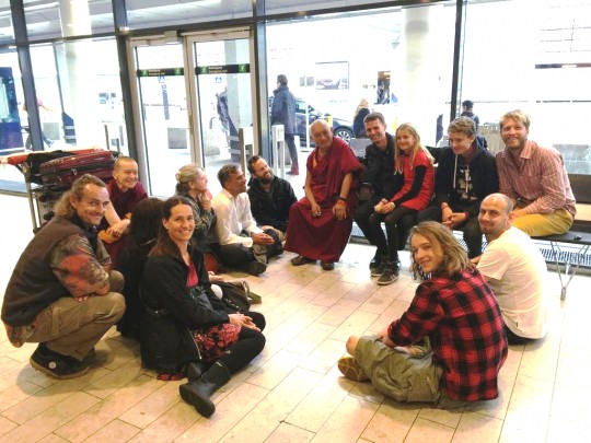 Lama Zopa Rinpoche giving advice to students that Copenhagen airport, Denmark, July 2015. Photo by Ven. Roger Kunsang.