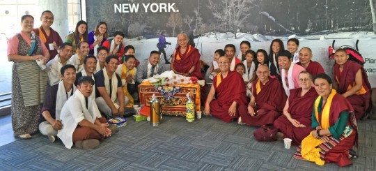 Lama Zopa Rinpoche being greeted at the airport by Sherpas living in  New York, July 2015. Photo by Ven. Roger Kunsang.