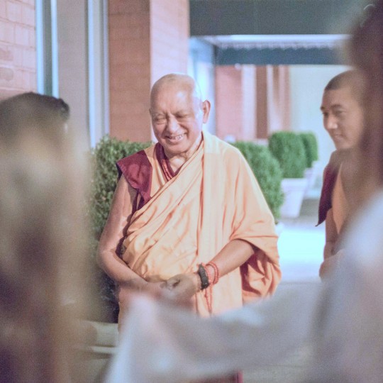 Lama Zopa Rinpoche arriving at a teaching in New York City, August 2015. Photo by Edward Sczudlo.