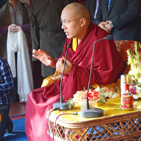 His Holiness the Karmapa giving a talk to students and teachers at Maitreya School, Bodhgaya, India, 2014. Photo by Ven. Roger Kunsang.