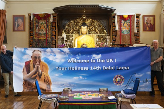 FPMT UK banner welcoming His Holiness the Dalai Lama held by Roy Sutherwood, director of Jamyang Buddhist Centre, and  and Mike Murray, SPC, in the gompa at Jamyang, London, UK, September 2015. Photo by Natascha Sturny. 