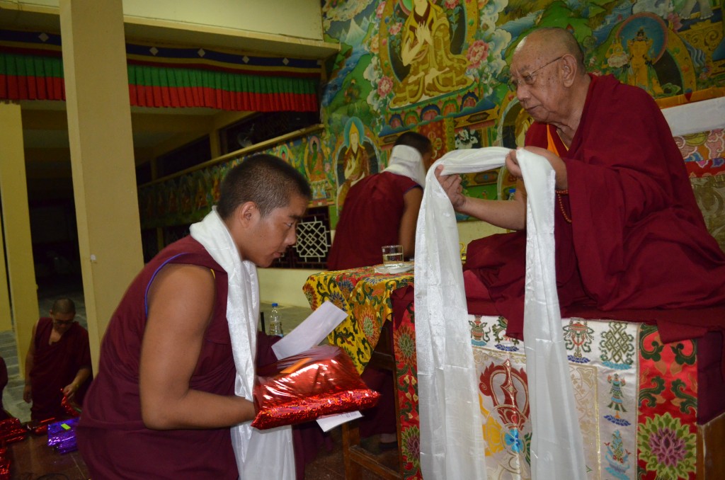Sera Je Monastery monk receives new robes sponsored by the Supporting Ordained Sangha Fund in recognition of his memorization.