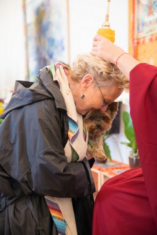 Woman and dog receiving blessings by relic of Buddha Shakyamuni, Johannissaal, Schloss Nymphenburg, Munich, Germany, September 2015. Photo courtesy of Robert Schwabe.