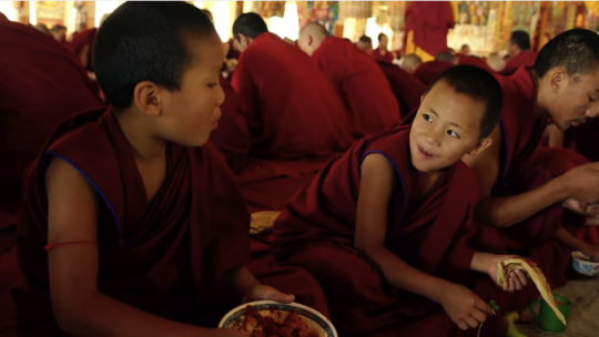 young monks eating