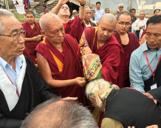 Lama Zopa Rinpoche blessing local Tibetans at the site of a new community hall Rinpoche is sponsoring, South India, December 2015. Photo by Ven. Holly Ansett.
