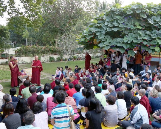 After the day's teachings with His Holiness the Dalai Lama, students gathered in the garden at Osel Labrang for Lama Zopa Rinpoche, who talked to students before giving blessings, Sera Monastery, India, December 2015. Photo by Ven. Thubten Kunsang. 