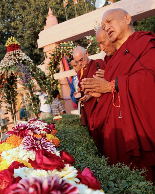 Lama Zopa Rinpoche at the Mahabodhi Stupa in Bodhgaya making offerings, February 2015. Photo by Ven. Thubten Kunsang.