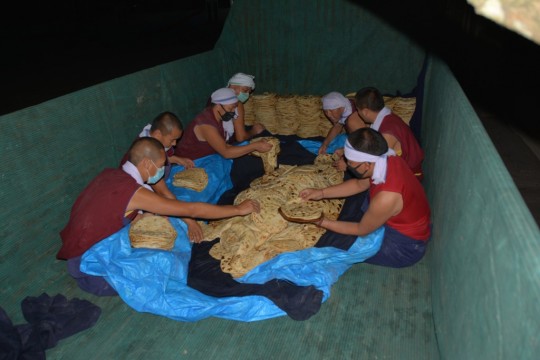 Bread for 30,000 getting carefully packed for transport to Tashi Lhunpo Monastery. 