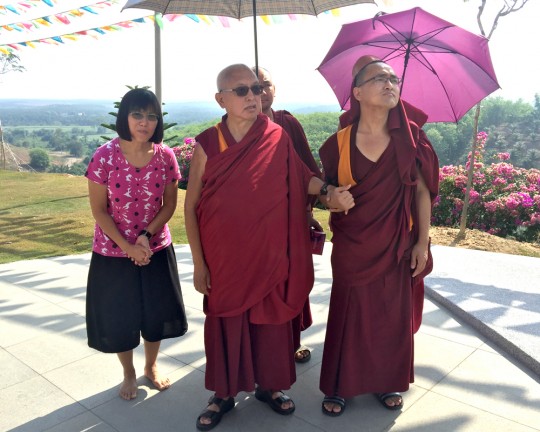 Lama Zopa Rinpoche with Selina Foong, director of Rinchen Jangsem Ling, and Ven. Losang Sherab, touring the retreat center grounds, Malaysia, April 2016. Photo by Ven. Roger Kunsang.