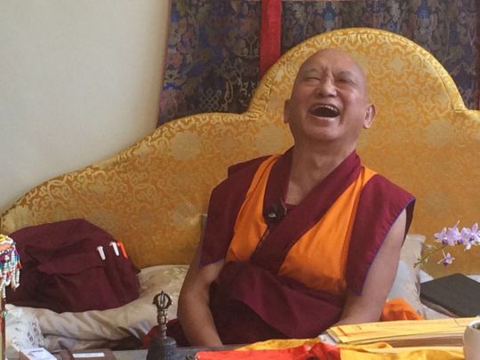 Lama Zopa Rinpoche enjoying a very funny moment, May 2016. Photo by Ven. Roger Kunsang via Twitter.