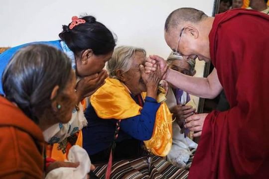 His Holiness the Dalai Lama meeting an 82 year old Tibetan lady during Lam teachings in South India, 2015.