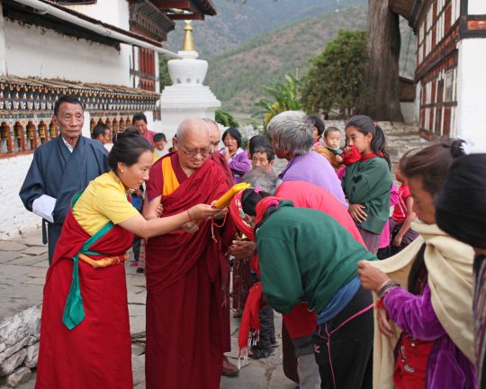Khadro-la and Rinpoche blessing people with texts at Kyichu Lhakhang, Bhutan, May 2016. Photo by Ven. Lobsang Sherab.