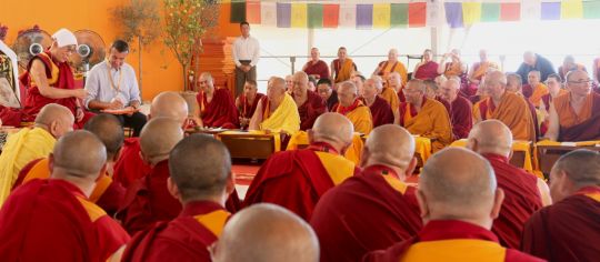 His Holiness the Dalai Lama addressing Lama Zopa Ripoche and an audience of geshes and Sangha, during his visit to Italy in June 2014. His Holiness has a white cloth on his head because the weather was very warm. Photo by Ven. Thubten Kunsang.