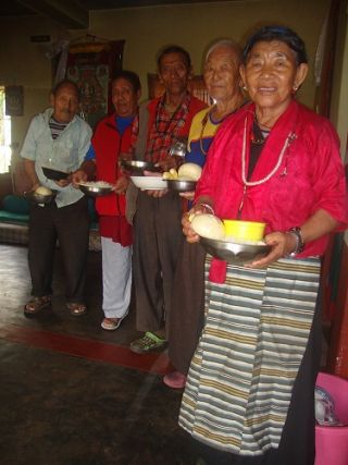 Members of the elderly home at Rabagayling Tibetan Settlement are offered food through a grant from the Social Services Fund. 
