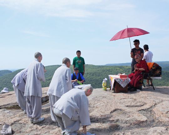 Korean monks and nuns making prostrations to Lama Zopa Rinpoche on top of Bear Mountain, New York, July 2016. Photo by Ven. Lobsang Sherab.