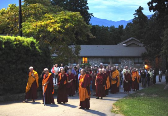 Lama Zopa Rinpoche leading students in a walking meditation at the Light of the Path Retreat, North Carolina, US, August 2016. Photo by Ven. Lobsang Sherab.