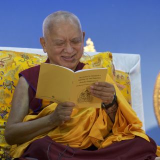 Lama Zopa Rinpoche reading from The Method to Transform a Suffering Life into Happiness, April, 2016. Photo by Bill Kane. 