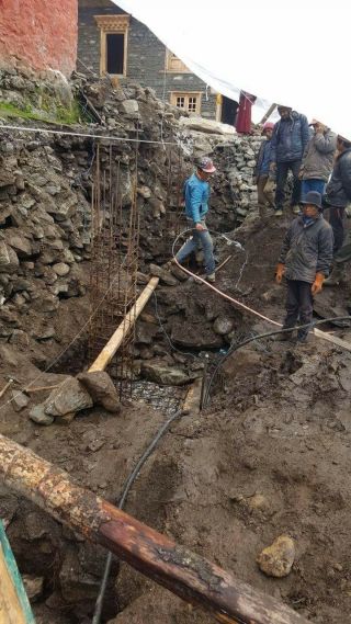 Laying the foundation for the new gompa. 