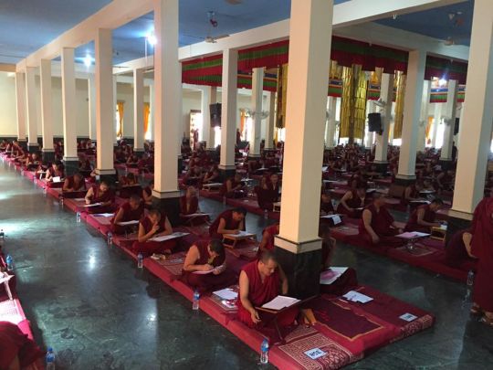 In addition to debate, the monks are required to pass a written examination. 