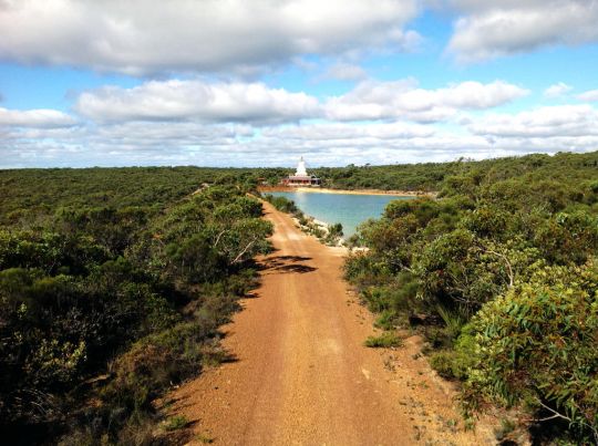 View of De-Tong Ling's stupa and dam surrounded by pristine Australian bush. Photo by Center Director Will Abram. 