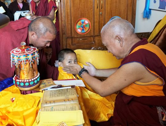 Lama Zopa Rinpoche meeting the reincarnation of Khensur Rinpoche Lama Lhundrup, Tenzin Rigsel, for the first time. Kopan Monastery, November 2016. Photo by Ven. Lobsang Sherab.