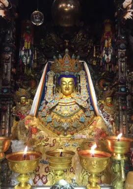 Offering Gold and Robes to Precious Jowo Statue in Tibet
