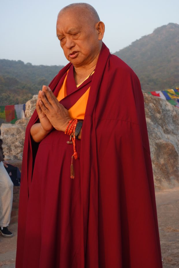 Lama Zopa Rinpoche does prostrations at Vulture's Peak, the site of Buddha's first teaching, Rajgir, India, February 2, 2014. Photo by Ven. Roger Kunsang.