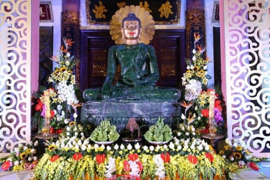 The Jade Buddha surrounded by floral offerings after the unveiling at Yen Phu Temple, Hanoi, Vietnam, June 2016. Photo courtesy of Ian Green's Twitter page.