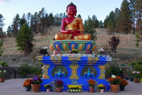 The incredible Amitabha statue at Buddha Amitabha Pure land, with flower offerings Sept 4 2016 by Ven. Roger Kunsang