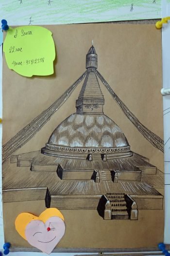 Stupa drawing in white and black colored pencil on brown paper.